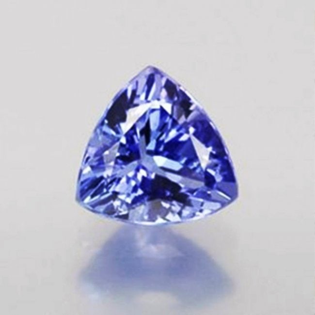 Loose Tanzanite Trillion Shape .97Ct 6.5x6.4x4 mm: Gem Type: Natural Tanzanite Qty: 1 Weight: .97 Carat Measurement: 6.5x6.4x4 mm Shape: Trillion Cut: Facet cut Clarity: VVS Color: Light Violet/Blue Treatment: None Origin: Tanzania