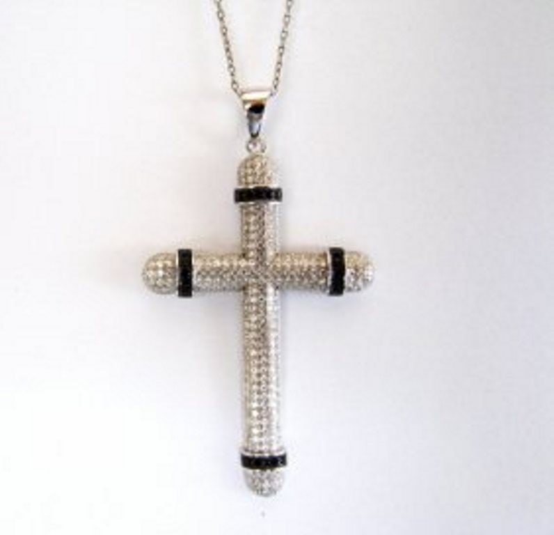 Creation White/Black Dia Cross Pendant 18k W/G Overlay: Gem Type: Creation White/Black Diamond Item: Cross Pendant White Stone: 2.16 carat Round 216 pieces Clarity: VVS1/Color: F Black Stone: .24 Carat round 24 pieces Clarity: Opaque/Color: Fancy Black Met