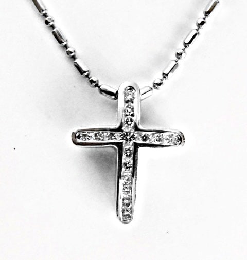Diamond Cross Pendant: .35 Carat 14k W/g: Gem type: Natural Diamond Item: Pendants Diamonds 16 Pieces Weight: .35 carat Round brilliant (Clarity: VS1/Color: G/Treatment: None) Face size 5.2 x 2 mm/Thickness:4 mm Metal:14k white gold