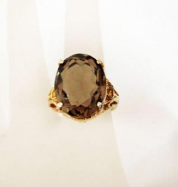 Natural Smoky Topaz Ring 12.19Ct 14k Y/g: Gem Type: Natural Smoky Topaz Item: Ring, Size; 7, Band Thickness: 2-3mm Weight: 12.19 Carat Oval Facet Cut Measurement: 17.3x13.3x8 mm Clarity: Transparent, Color: Light Brown Treatment: None