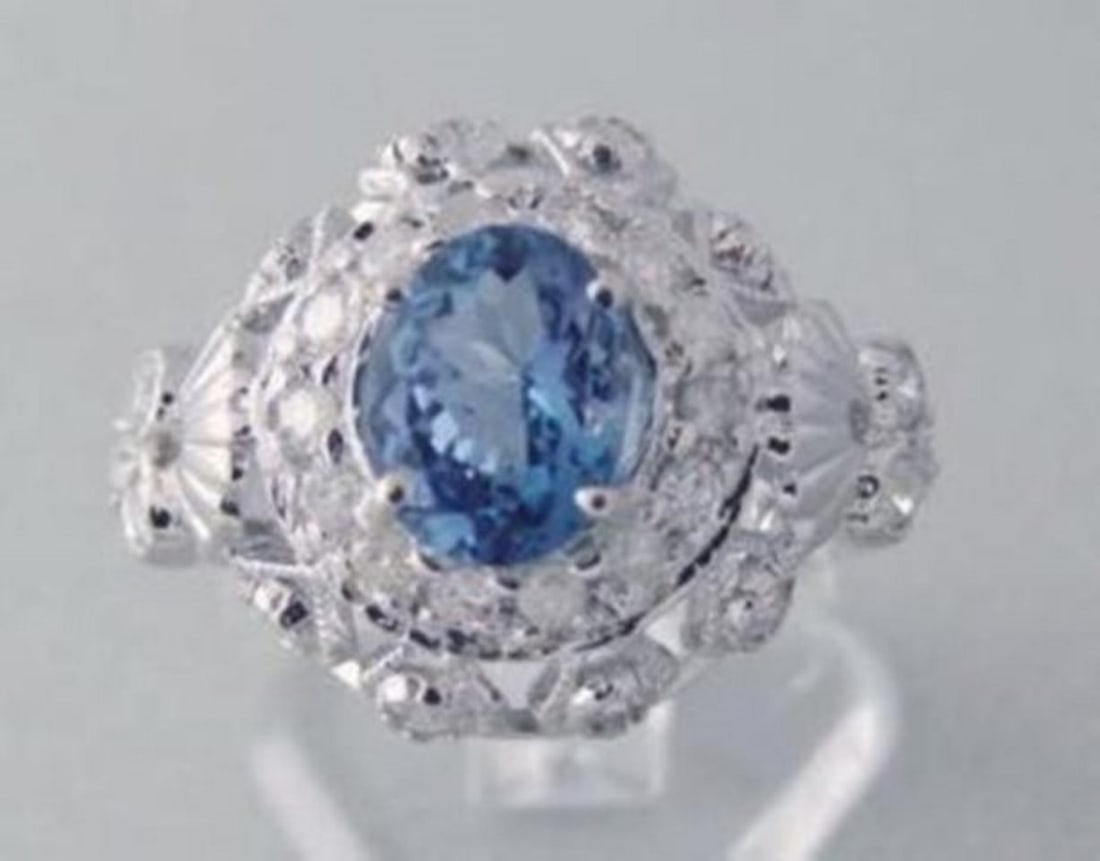 Tanzanite Ring 1.73CT Diamond: 1.00 CT 14k W/g: Gem Type: Natural Tanzanite & White Diamond Qty: 1 Condition: New Item: Ring (Size: 7) Band thickness: 3-4mm Total diamond weight: 1.00 carat round brilliant Clarity: SI1, Color: H, Treatment: None