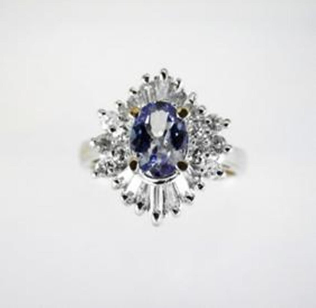 Natural Tanzanite Diamond Ring: 1.92Ct14K Y/g: Gem Type: Natural Tanzanite and Diamond Ring Diamond:10 Pieces,Weight:.30 Carat, Round Brilliant Diamond:14 Pieces Baguette,Weight:.42 Carat Clarity: SI1-Color: H-Treatment: None Tanzanite