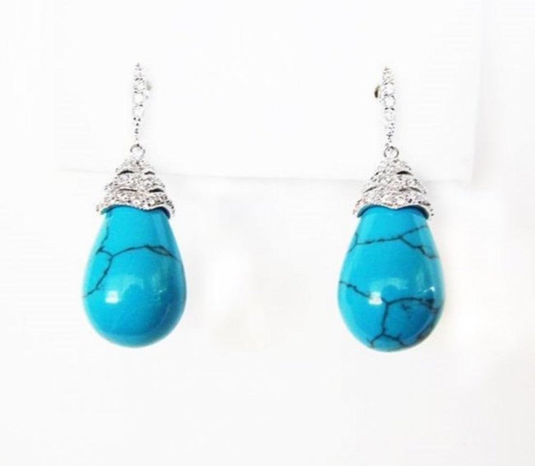 Natural Turquoise Earrings 18.20Ct 18k W/g Overlay: Gem Type: Natural Turquoise,Creation Diamond Qty: 1 Pairs Item: Earrings Creation Diamond 70Pce Weight: 1.40 Carat round Brilliant Clarity: VS, Color G Turquoise weight: 16.80 Carat Pear Drop Shaped (