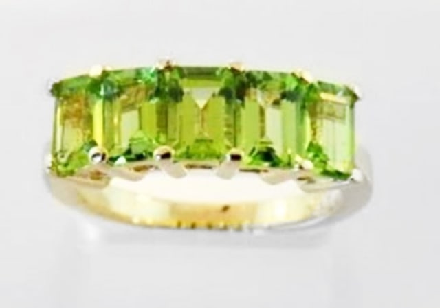 Peridot Emerald Shape Ring 3.75 Carat 14k Y/g: Stunning Peridot Band Setting with Five Stones 3.75 carat Periot natural Shape: Emerald cut Origin: Brazil Clarity: Transparent, Color: Green, Treatment: Untreated, Hardness: 6. 1/2 14k