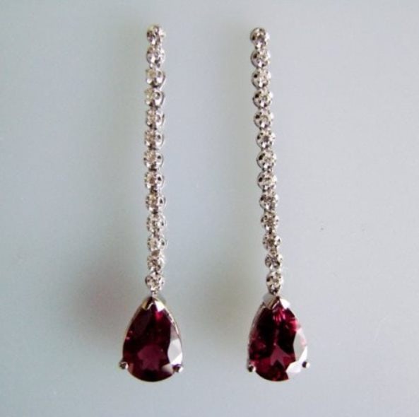 Pink Tourmaline: 4.23CT Diamond: .52CT Earrings14k W/g: Gem Type: Natural Pink Tourmaline and White Diamond Item: Earrings Length: 1.75" inch Long 26 Pieces Diamond weight: .52 carat Round Brilliant (Clarity:SI1, Color: H ) Tourmaline Weight: 4.23 Carat