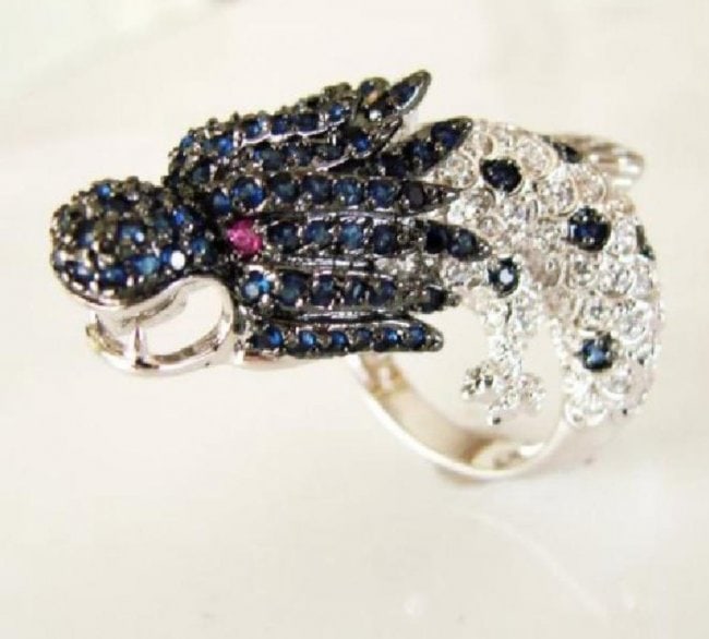 Creation Dia,sph,rb Dragon Ring 3.44Ct 18k W/G Overlay: Creation Diamond, Sapphire, Ruby Ring High Quality Item Item: Ring Weight: 3.44 Carat round brilliant Prong Setting L1.1/2" x W3/4",Thickness:2-4 mm 18k White gold overlay 925 silver Weight: 13.80gram