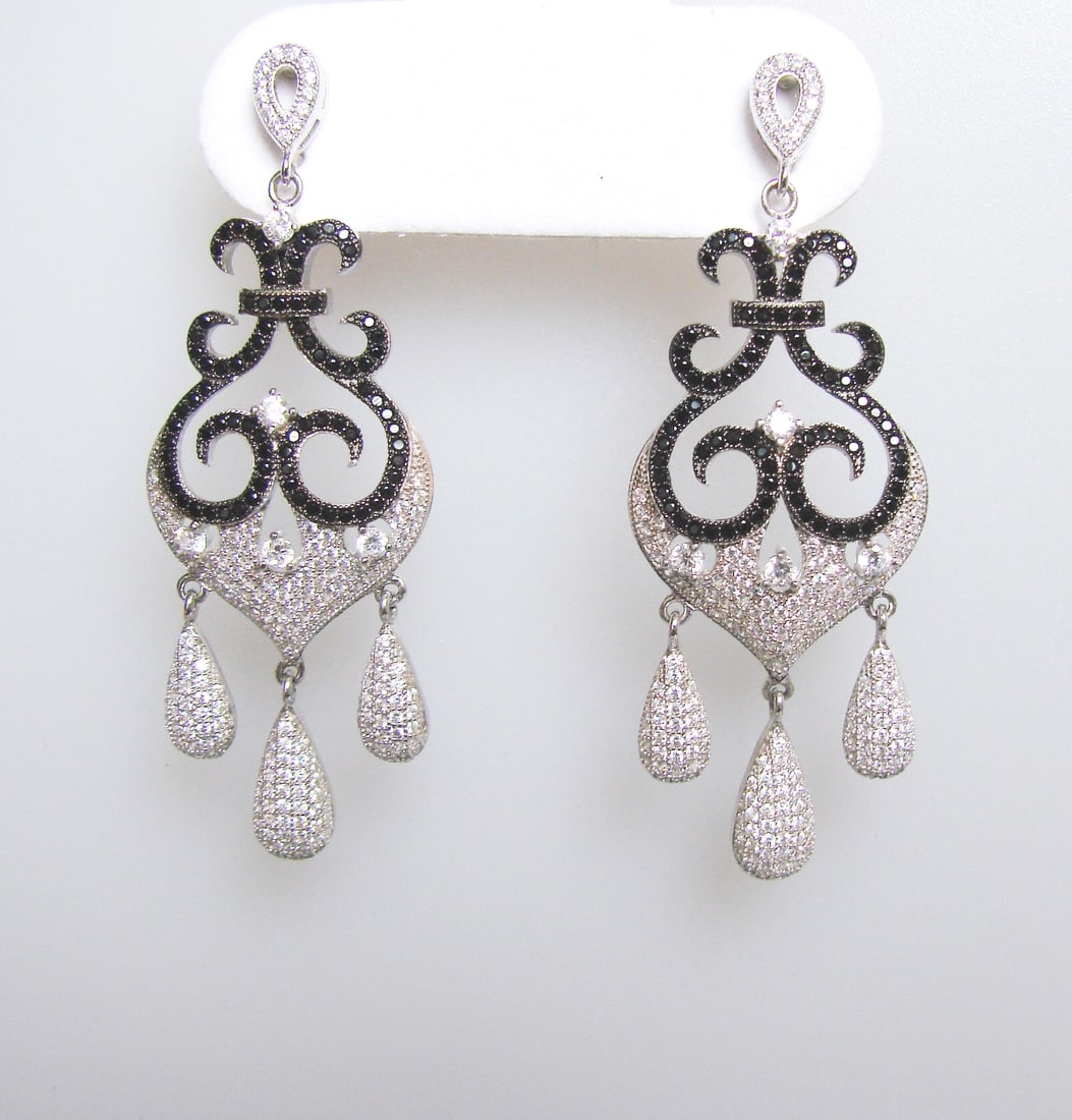 Creation Diamond Chandeliers Ear 3.74Ct 18k W/g Overlay: Creation Diamond Chandeliers Earrings and High Quality Item Item: Earrings Total: 3.74 carat Round brilliant (Clarity: VVS, Color: F) Creation Black Diamond Length: 2.1/4"x 3/4" inch Setting: Micro Pa