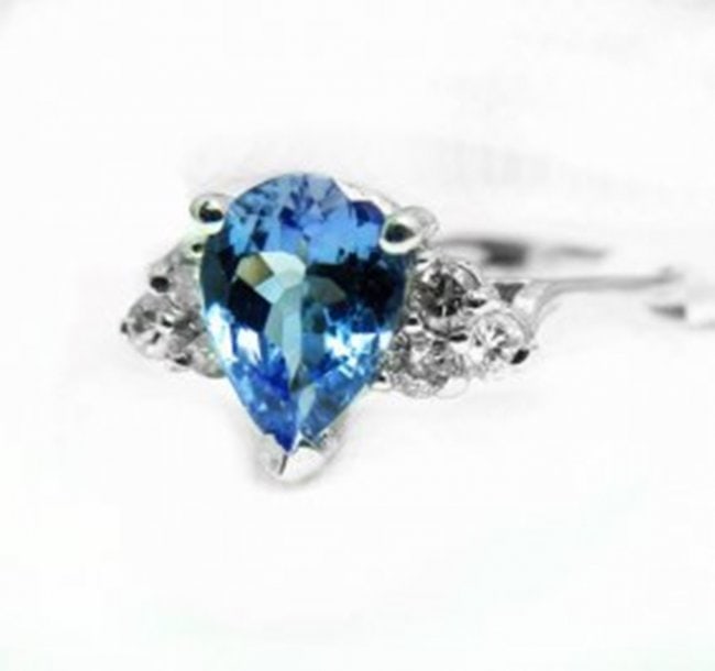Natural Tanzanite & Diamond Ring 1.73Ct 14k W/g: Gem Type: Natural Tanzanite and Diamond Diamond: 6 Pieces Weight: .25 carat Round Brilliant Clarity: SI2 Color: H, Treatment: None Center Tanzanite 1.48 carat Pear Facet Clarity: VS1,Color: Blue/Viole