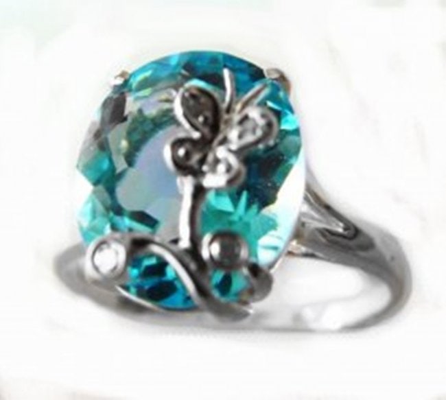 Swiss Blue Topaz Diamond Ring 4.88Ct14k W/g: Gem Type: Natural Swiss Blue Topaz and Diamonds Item: Ring Size:7 Diamonds 4 Pieces Weight:.10 Carat Round Brilliant Clarity:SI2,Color:H,Treatment:None Center Blue Topaz:4.78 Carat Clarity: VVS, Color
