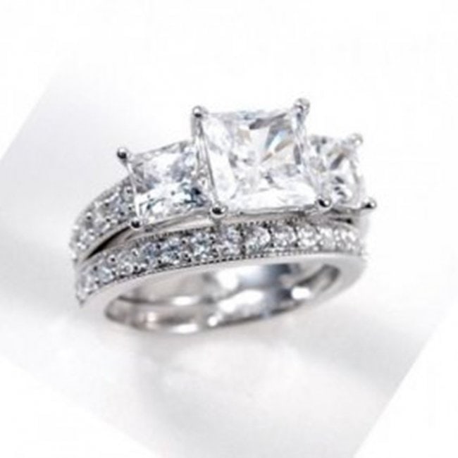 Creation Diamond Ring 3.27 Carat 14k W/G Overlay: Creation Diamond High Quality Qty: 2 Total Weight 3.27 carat 3 Stones total weight: 2.45 carat Princess cut ( Clarity: VVS, Color: F) Small Stones weight: .82 carat round shape (Clarity: VS, Color: F)
