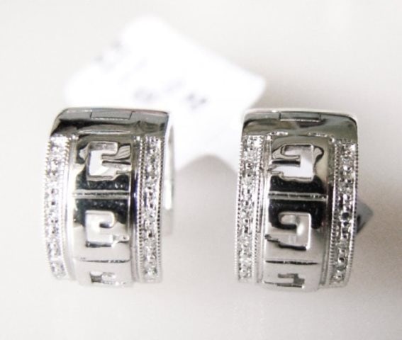 Diamond Hoop Earrings .10Ct 14k White Gold: Gem Type: Natural Diamond Quality: 1 Pairs Diamond 24 pieces round brilliant Weight: .10 carat Clarity: SI1, Color: G, Treatment: None Gold: 14k white gold Weight: 3.24 grams Diameter: 12.3x7.5mm