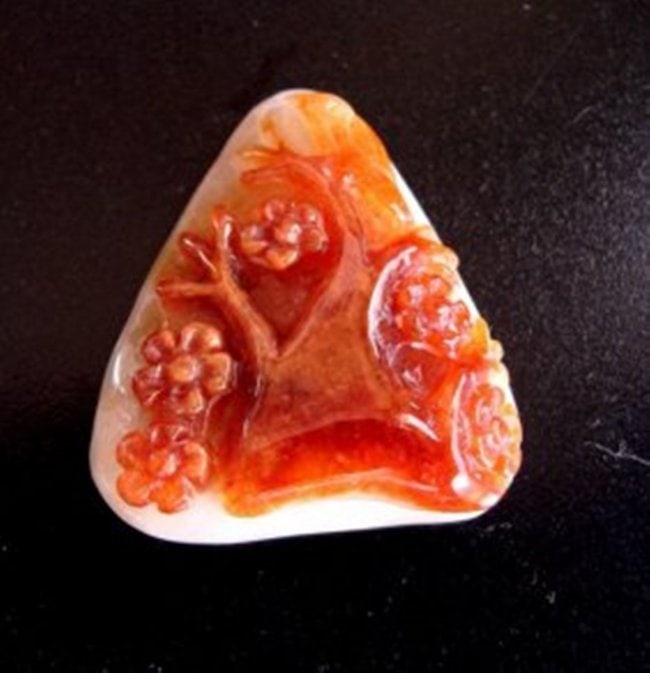 Natural Carved Jade Pendant Grade: "A" Certification: Certification (GJLC)#891DB513155 Grade: A Item: Pendant Weight: 19.69 Grams Height: 1.5" x Width: 1.25" inch Thickness: 10.5 mm Shape: Trillion Hand carved:Three & Birth Design Color: Gray & Bro