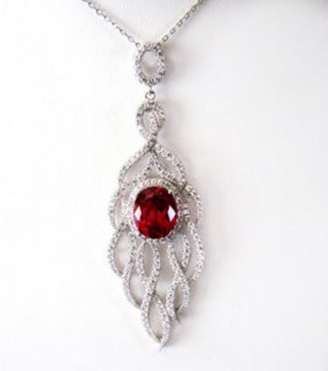 Creation Daimond Ruby Pendant 8.25Ct 18k W/g Overlay: Creation Diamonds/Ruby high quality Item Item: Pendant/Size L 2.25" x W .75" inch 185 Pieces Creation Diamond 2.78 carat Round (Clarity: VS1, Color D) Creation Ruby: 5.47 Carat Oval shape (Clarity: VS
