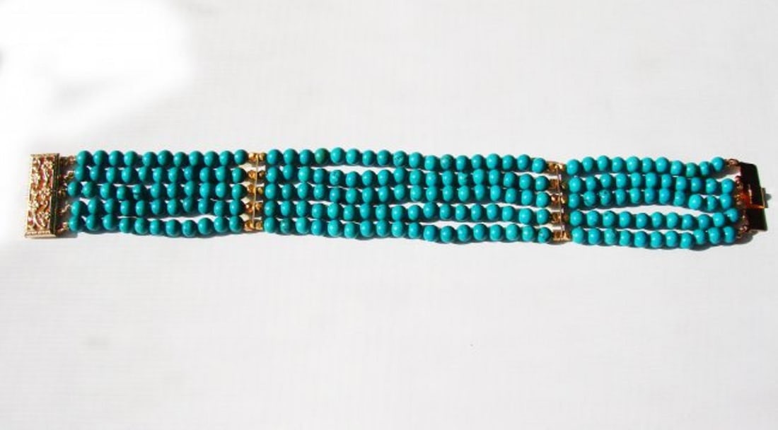 5 Layer Turquoise Bead Bracelet with Gold Filled Claps: Gem Type: Natural Turquoise Qty: 1 Length: 7" Width: 1" Gold Filled Clasp, Beads, and Dividers (Not Gold Plated) Gemstone: Natural Turquoise Ball Shaped Gemstone (4mm) Not Color Treated* Hardness: 5