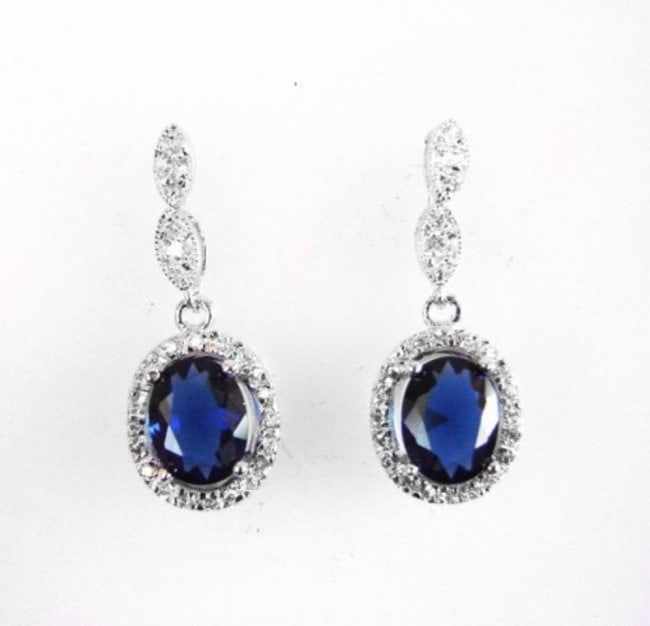Creation Diamond/Blue Sapphire Ear 3.00Ct 18k W/g Over: Gem: Creation Diamond/Blue Sapphire Qty: 1 Item: Earrings Center stone: 3.00carat oval shape, size 8x7mm (Clarity: VSI, Color: Blue) Creation Diamond: . 83 carat round (Clarity: VSI, Color: E) Metal: 