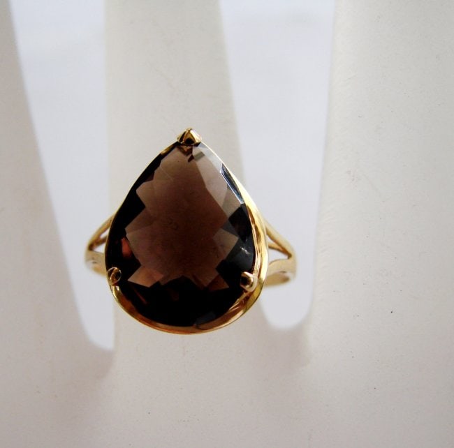 Natural Smoky Topaz Ring 5.35Ct 14k Y/g: Gem Type: Natural Smoky Topaz Item: Ring Weight 5.35 carat Pear Shape Checkerboard Cut Clarity VS1, Brown, Treatment: None Measurement: 14x10 mm 14k yellow gold and (1.92grm) Size: 7.5 Condition: New<