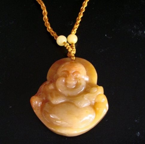 Natural Jadeite Jade Buddha God Pendant: Handwork Jadeite Carving Buddha God Carving Back Side Smooth Item Type: Pendants Grade: B Origin: Beijing China (Mainland) Color: Golden and Blood Style: Trendy Jade Weight: 32 grams Size: H 1.1/2" x