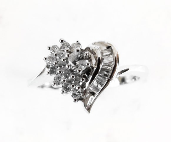 Diamond Heart Ring: .35 Carat 14k W/g: Gem type: Natural Diamonds Item: Ring Diamonds 13 Pieces Weight: .25 carat Round brilliant (Clarity: SI2/Color:H/Treatment:None) Diamond Baguette 7 Pieces Weight: .07 Carat (Clarity: