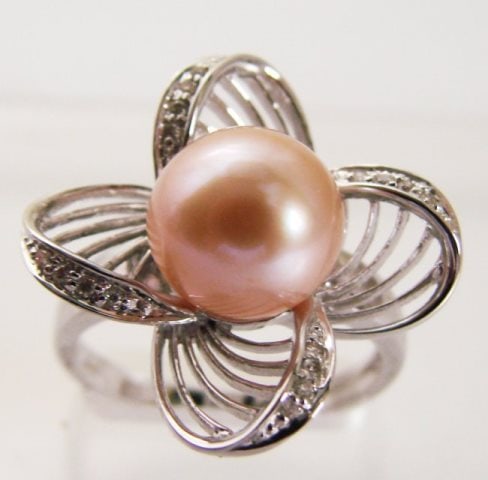 9.5mm Culture Pearl and Diamonds Ring .15Ct 14kW/g: Gem Type: Natural Culture Pearl and Diamonds Item: Ring Diamonds 16 Pieces Weight: .15 Carat Round Brilliant (Clarity: VS2 ,Color: G, Treatment: None) Pearl: 9.5 mm Round Grade: AAA, Color: Peach, Lus