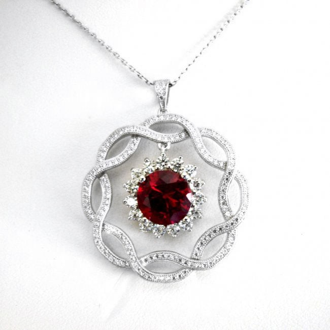 Creation Daimond Ruby Pendant 7.93Ct 18k W/g Overlay: Creation Diamonds/Ruby high quality Item Item: Pendant/Size L 1.5" x W 1.25" inch 168 Pieces Creation Diamond 2.58 carat Round (Clarity: VS1, Color D) Creation Ruby: 5.35 Carat Round shape (Clarity: V
