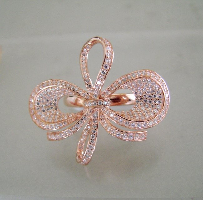 Creation Diamond Ring 3.46Ct 18k R/g Overlay: Gem Type: Creation Diamond High Quality Item: Ring Ring Face diameter: L 1.3/4" x W 1.1/4" 231 Pieces: 3.46 carat Round Brilliant Clarity: VVS, Color: F Setting: Micro Pave Metal: 18k Rose gold Overla