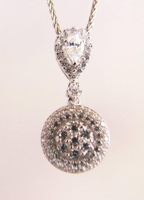 Creation Diamond Pendant 1.00Ct 18k W/g Overlay: Gem Type: Diamonds Creation High Quality Item Item:Pendants Weight: 1.00 carat Pear and Round Brilliant (Clarity: VVS-Color F) Setting name: Micro Pave Metal: 18k White gold overlay 925 silver Weight: