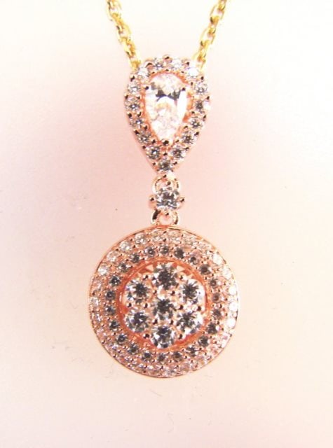 Creation Diamond Pendant 1.00Ct 18k R/g Overlay: Gem Type: Diamonds Creation High Quality Item Item:Pendants Weight: 1.00 carat Pear and Round Brilliant (Clarity: VVS-Color F) Setting name: Micro Pave Metal: 18k Rose gold overlay 925 silver Weight:3