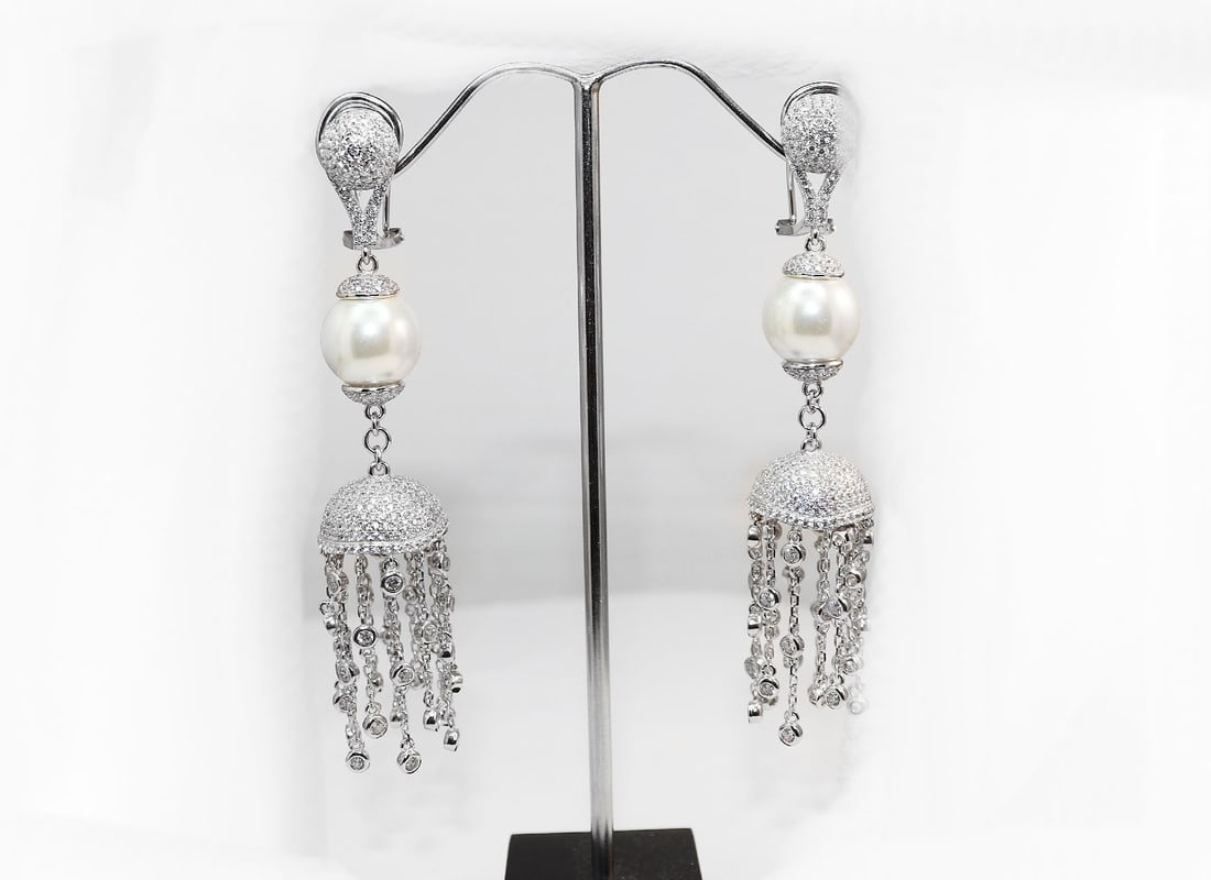 Creation Diamond Earrings 3.57CT 18k W/g Overlay: Gem Type: Creation Diamond/ Swarovski Pearl Item: Earrings/Length: 3 inches, Width: 15mm White Stone: 3.57 Carat round brilliant Clarity: VS1 Color: G Swarovski Pearl, Size: 12mm, Luster: Excellent, C