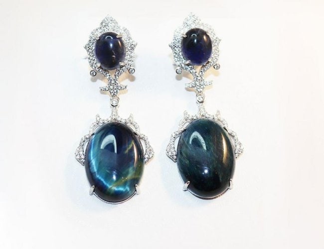 Creation Diamond/ Golden OBSIDIAN Chandelier Earrings: Gem Type: Creation Diamond/ Golden OBSIDIAN Item: Earrings/Length: 2.5 inches, Width: 18mm White Stone: .2.5 Carat round brilliant Clarity: VS1 Color: G 4 Golden OBSIDIAN: 65.36 Carat Oval Shaped, Cla