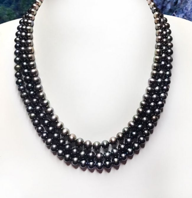 Triple-Strand Freshwater Pearl Strand Necklace: Triple-Strand Pearl Necklace Size 5 to 7 mm Peacock Color Gem: Type: Freshwater Pearl Length: Inside Lay 17" and Out Lay 19" Luster: Excellent Color: Peacock Clasp: 14k yellow gold Knot: Every each pe