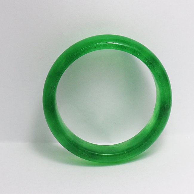 Natural Translucent Solid Green Chinese Jade Bangle: Gem Type: Natural Translucent Solid Chinese Jade Grade: B Item: Jade Bangle, Size 7 Outer Diameter: 75 mm Inter Diameter: 60mm Width: 17.5mm Thickness: 8.3mm Weight 63.7 grams Treated: Untreated