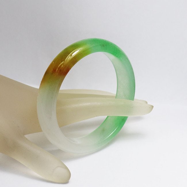 Translucent Solid Multi-Color Chinese Jade Bangle Size:: Gem Type: Natural Translucent Solid Chinese Jade Grade: B Item: Jade Bangle, Size 7 Outer Diameter: 75 mm Inter Diameter : 60mm Width: 14.5 Thickness: 8 mm Weight : 49.89 grams Treated: Untreated