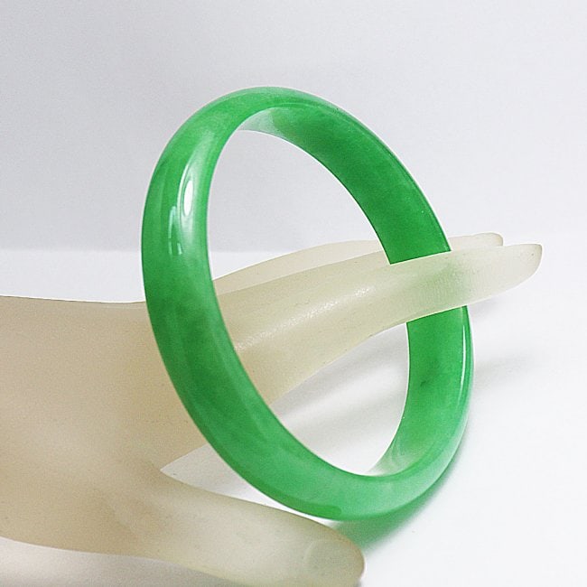 Translucent Solid Green Chinese Jade Bangle Size: 7.5: Gem Type: Natural Translucent Solid Chinese Jade Grade: B Item: Jade Bangle, Size 7.5 Outer Diameter: 68 mm Inter Diameter: 56mm Width: 13.3mm Thickness: 7 mm Weight 56.19 grams Treated: Untreated