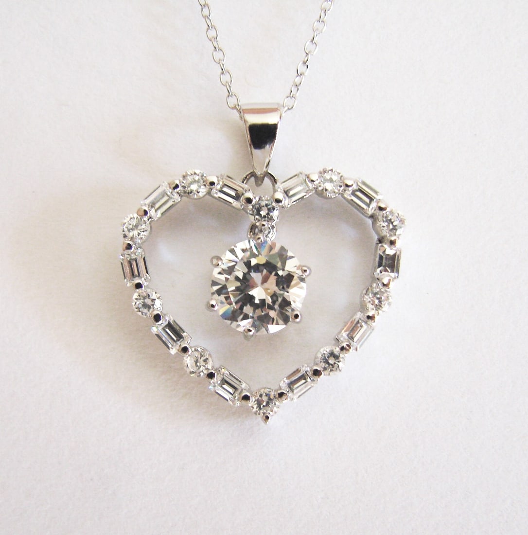 Creation Diamond Heart Pendant 3.79Ct 18k W/g Overlay: Creation Diamond Pendant High Quality Item Item : Heart Pendant Total : 3.79 Carat Center 2.15 Carat and Baguette and Round 1.64 Carat (Clarity: VS, Color: F) Setting Prong Length: 1" inch 18k White