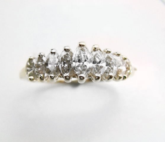 Anniversary Diamond Marquise Ring 1.02Ct 14k Y/g: Gem Type: Natural Diamonds Marquise Item: Ring ( Size: 7) Diamonds 9 Pieces, Weight: 1.02 Carat Clarity: VS2, Color: Champagne, Treatment: None Metal: 14k Yellow Gold, Weight: 2.58 grams Size: 7, Band