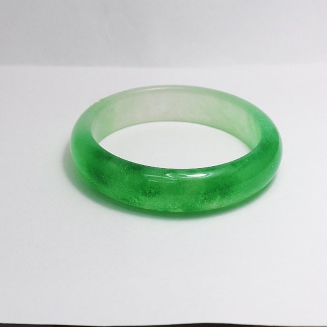 Translucent Solid Green/Creamy Chinese Jade Bangle Size7: Gem Type: Natural Translucent Solid Chinese Jade Grade: B Item: Jade Bangle, Size 7 Outer Diameter: 71 mm Inter Diameter: 60 mm Width: 16.2 Thickness: 9 mm Weight 66.64 Treated: Untreated