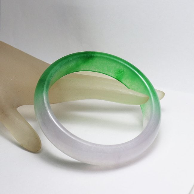 Translucent Solid Green/ Light Violet Chinese Jade Bang: Gem Type: Natural Translucent Solid Chinese Jade Grade: B Item: Jade Bangle, Size 7 Outer Diameter: 75 mm Inter Diameter: 60 mm Width: 17 mm Thickness: 8.4 mm Weight 64.06 Treated: Untreated
