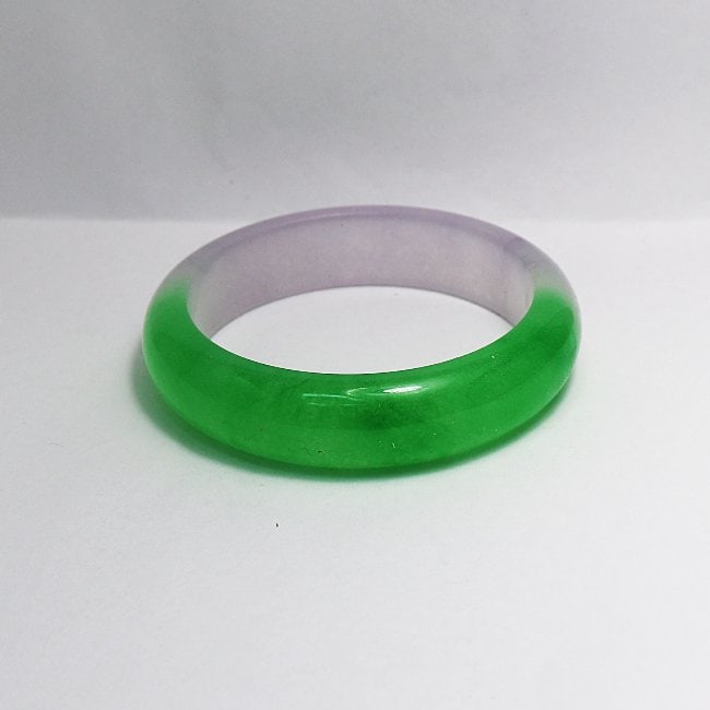 Translucent Solid Green/ Light Violet Chinese Jade: Gem Type: Natural Translucent Solid Chinese Jade Grade: B Item: Jade Bangle, Size 7 Outer Diameter: 78 mm Inter Diameter: 61 mm Width: 16.4 Thickness: 9.5 mm Color: Green/ Light Violet Weight 67.66