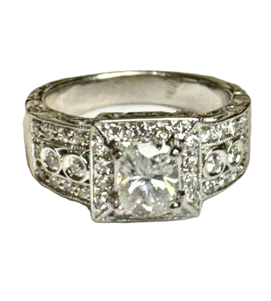 Engagement Ring Oval Shaped 2.22 Carat 18k W/G: Gem Type: Natural Diamond Item: Engagement Ring, Size: 7 Center: 1.13 carat Oval shaped, Size: 6.8x5.3x3.9mm Clarity: SI2 Color: H-I, Treated: enhanced Small Diamond: .76 Carat round Brilliant Clarity