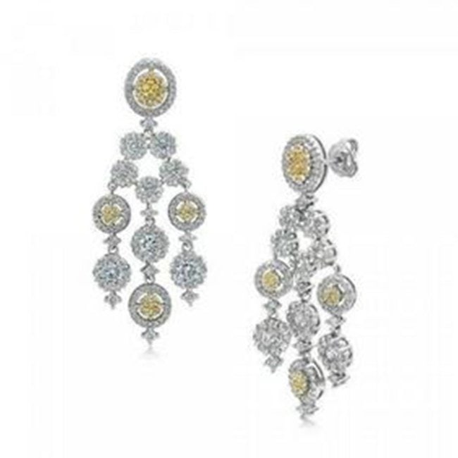 Creation, W/Y Diamond Chandelier Earrings 1.90CT 18K W/g: Item: Chandelier Earrings Length: 1.80 inches Width: 70mm White Stone: 1.30 Carat round brilliant Clarity: VS1, Color: F Yellow Stone: .60 Carat round brilliant Clarity: VSI, Color: Yellow Fancy Metal