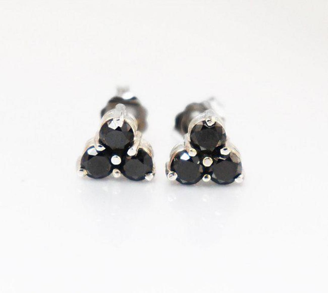 Black Diamond Stud Earrings .72 Ct White Gold: Gem Type: Natural Black Diamond Item: Earrings Weight: .72 Carat round shaped Clarity: Opaque Color: Fancy Black Metal: 14K white gold, Weight: 1.76 grams Backing: Push/Pull Condition: New Polis