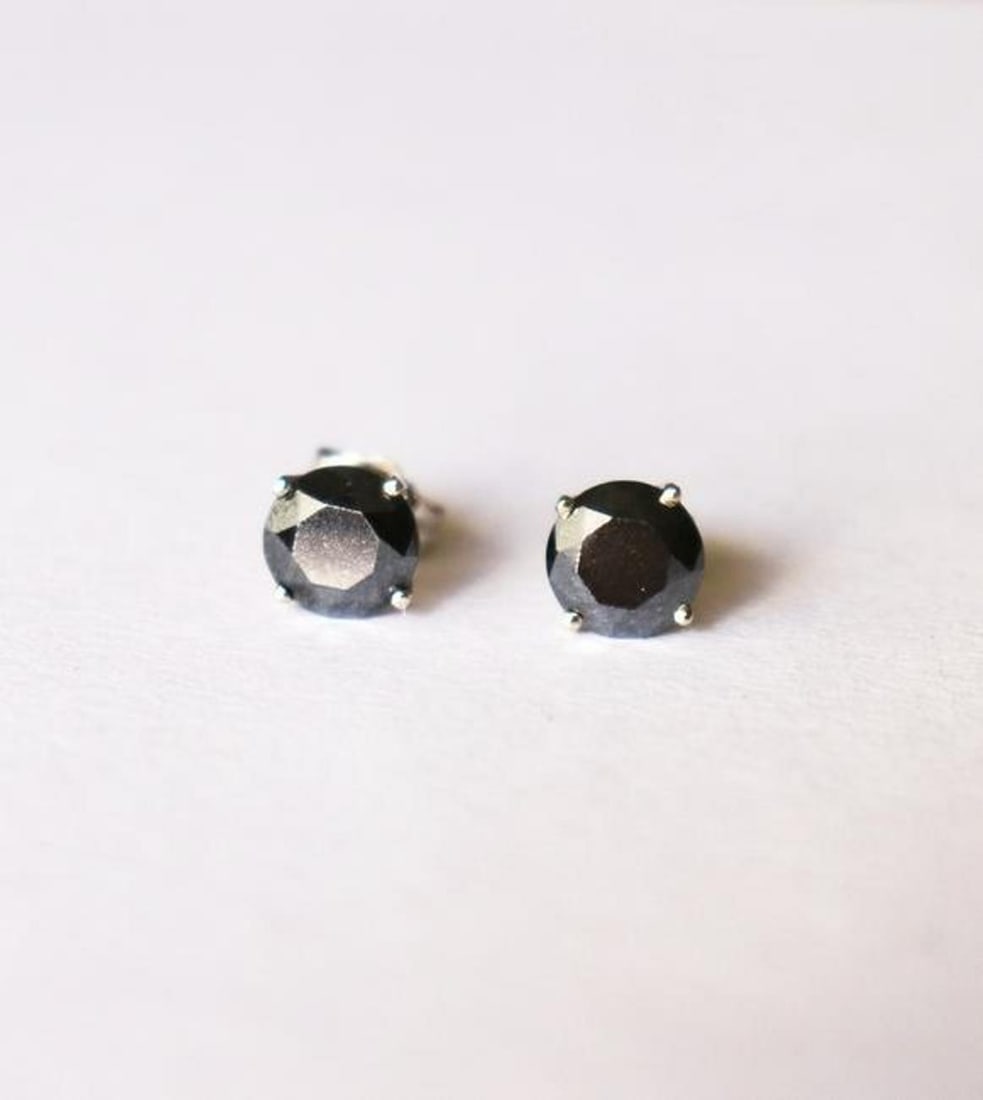 Black Diamond Stud Earrings 2.36Ct 14k W/g: Gem Type: Natural Black Diamond Earrings Quantity: pair Black Diamond:2.36 carat round shape Measurement:6.5mm Cut: Facet cut Clarity: Opaque Color: Fancy Black Luster: Very good Gold: 14k White gold