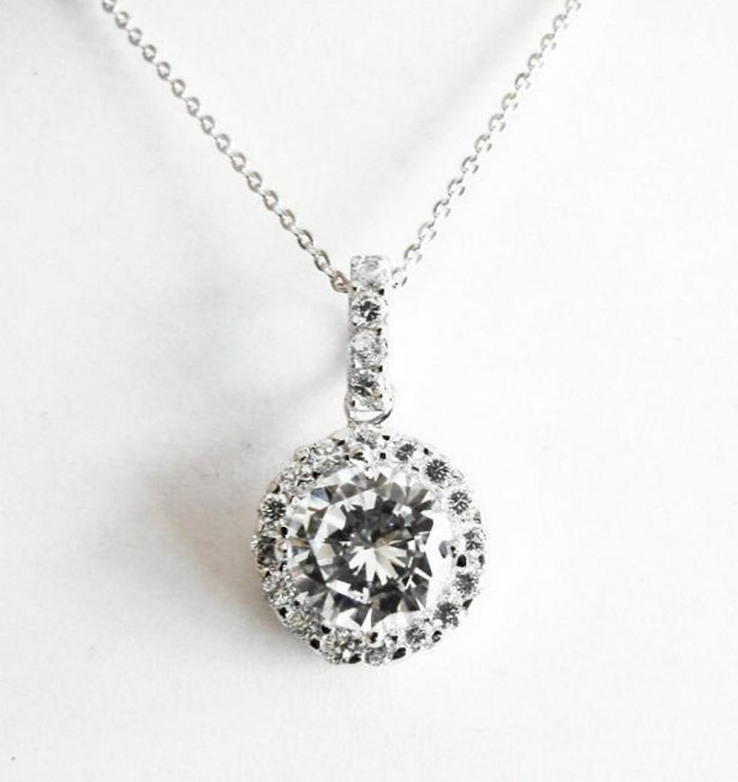 Creation Diamonds Pendant 3.00Ct 18k W/g Overlay: Gem Type: Creation Diamonds High Quality Item: Pendant Center Weight: 2.50 carat Round Brilliant Round Side Weight: .50 Carat Clarity: VVS, Color F Setting name: Prong 18k White gold overlay 925 silve