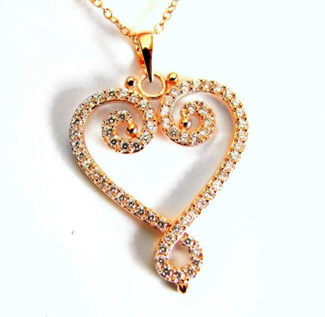 Creation Diamond Heart Pendant 1.16Ct 18k R/g Overlay: Gem Type: Creation Diamonds High Quality Item:Pendant 58 Pieces Weight: 1.16 carat Clarity: VVS1, Color F Setting name: Micro Pave 18k Rose gold overlay 925 silver Weight: 2.69 grams-Come With Chain 1