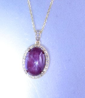 Natural Cabochon Star Ruby Pendant 15.86Ct 14k Y/g: Gem Type: Natural Diamond/Cabochon Star Ruby Item:Pendant Diamond: .56 carat round brilliant 32 Pieces Clarity: SI1, Color: G Star Ruby Weight: 15.30 carat, Size: 16.6x11.2x7.5 mm Shaped/Cut:
