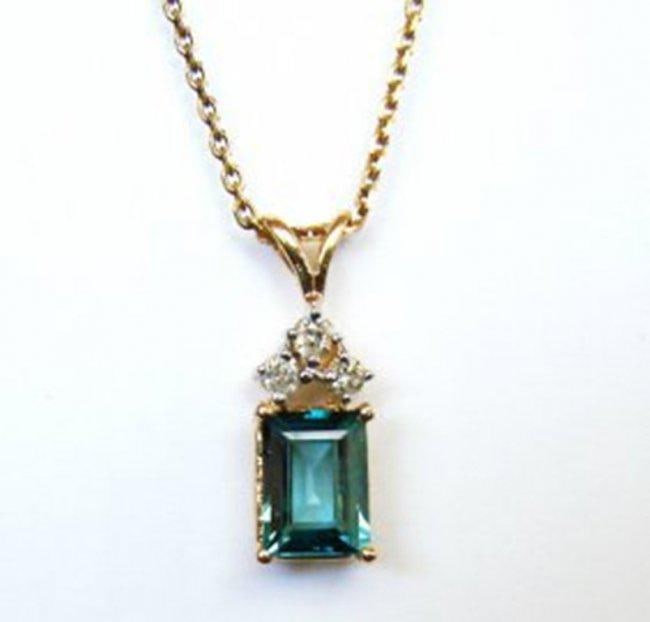 Diamond Blue Zircon Pendant 2.31Ct 14k Y/G: Gem Type: Diamon/London Blue Item: Pendant Shape: L3/4" x W1/4"inch Diamond 3 Pieces Weight: .20Carat Round Weight: 2.11 carat Shaped/Cut:Emerald Cut Shaped Measurement:8.5x6.3x3.2mm Clarity: