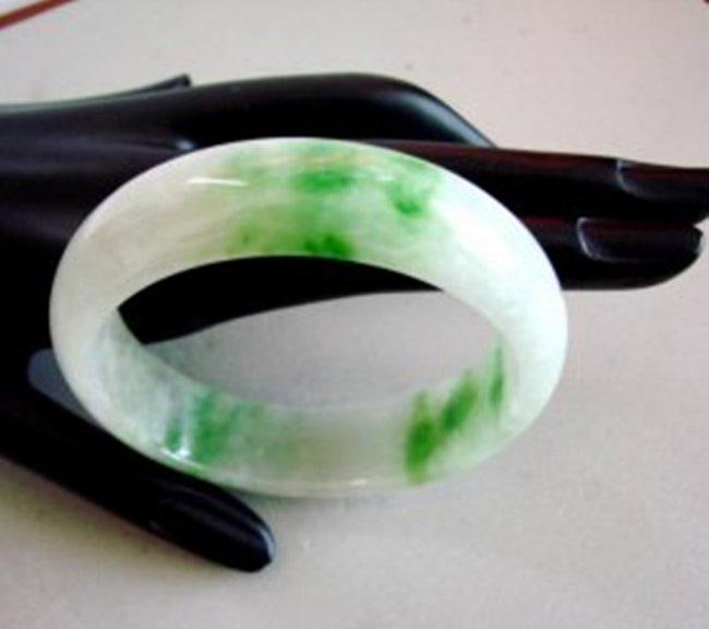 Natural Jade Bangle Grade A Size: 6.5: Remarks: Natural Jadeite Jade Item: Jade Bangle (Size: 6.5) Grade: A Weight: 64.30 gram Color: Emerald Green / Light Green Texture Transparency: Semi -Transparent Shape & Cut: Solid Jade/Halfway Round