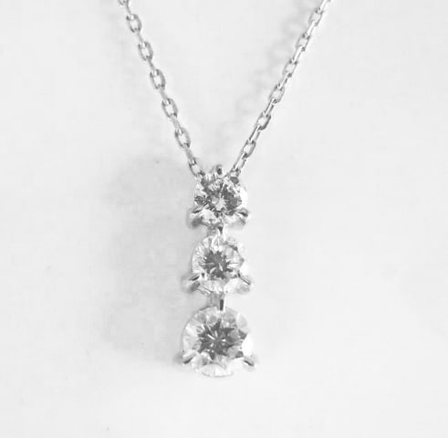 Graduation Diamond Pendant .79 Carat: Gems Type: Natural Diamonds Qty: Gems Type: Natural Diamonds Qty: 1 Item: Pendant, Come with a chain 16" Total diamond weight: .79carat round brilliant and (3 pieces) Clarity: VVS2, Color: G, Treatmen