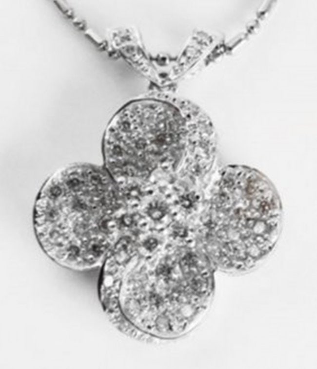 Cloverleaf Diamond Pendant: .90 Carat 18k W/g: Gem type: Natural Diamond Item: Pendants Diamonds 59 Pieces Weight: .90 carat Round brilliant (Clarity: VS1, Color: F, Treatment: None) Position of Pendant: L 1"x W 3/4" Metal: 18k white gold Weight: 