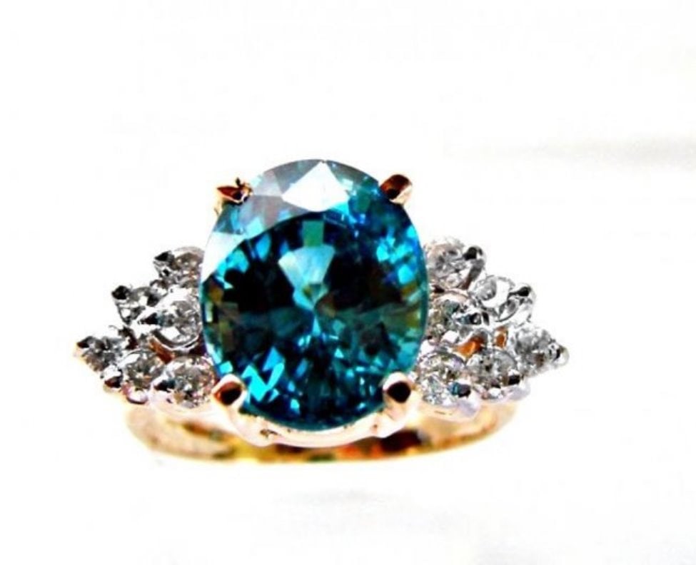 Natural Blue Zircon Ring: 7.22Ct Dia .54Ct 14k Y/g: Gem Type: Natural Blue Zircon and Diamonds Qty: 1 Condition: New Item: Ring (Size: 7) Band thickness: 2-3mm Total diamond weight: .54 carat round brilliant Clarity: SI1, Color: H, Treatment: None
